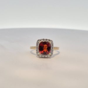 9ct Yellow Gold Red Garnet and 0.32ct Diamond Halo Ring