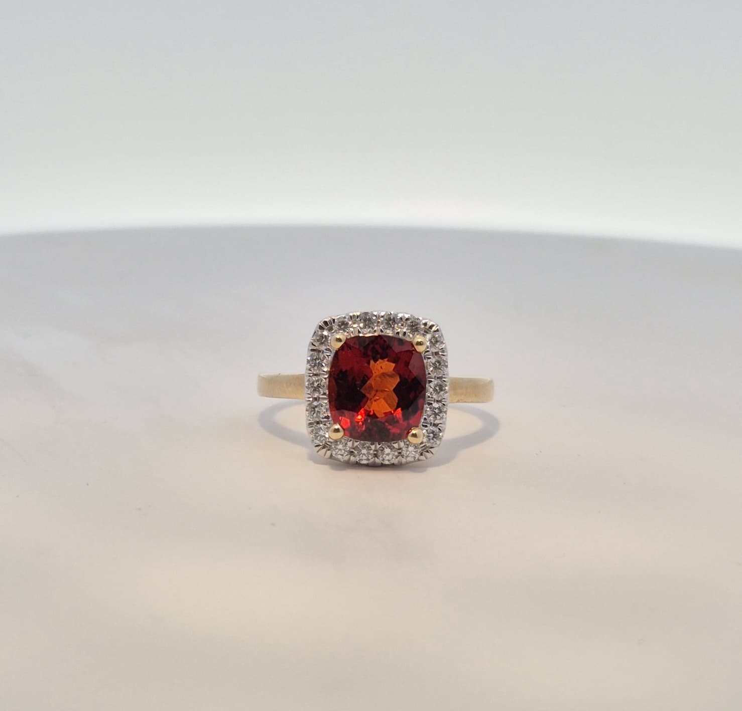 9ct Yellow Gold Red Garnet and 0.32ct Diamond Halo Ring